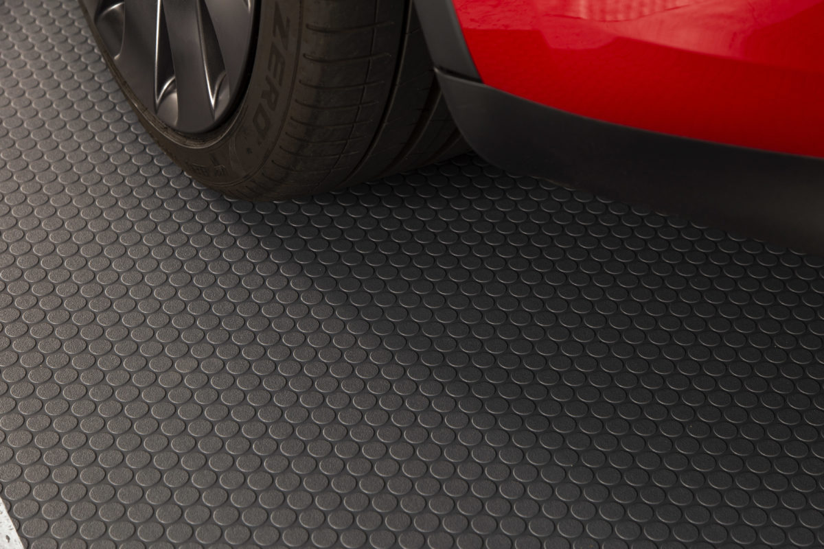 car parked on textured vinyl garage flooring