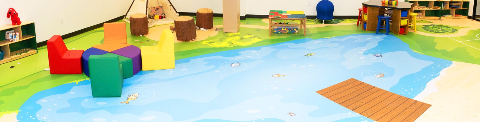 printed flooring in a kids space. flooring looks like a pond.