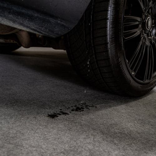Water from tire dripping on G-Floor Dip & Dry absorbent mat
